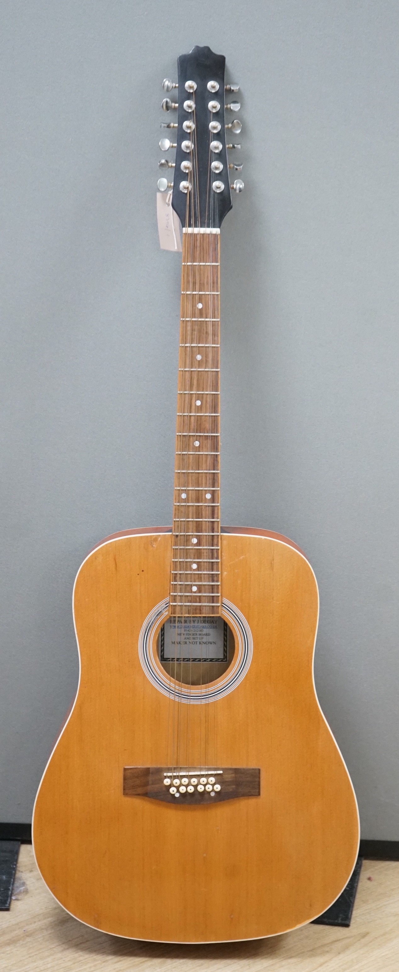 A 12 string acoustic guitar, unknown maker, repaired by John Degay of Degay Guitars